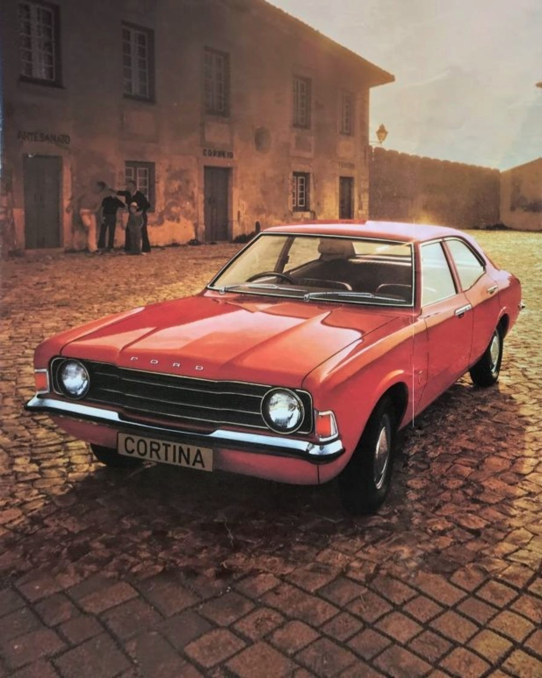 VaultifyUK Corgi Vanguards 1:43 scale Ford Cortina Mk4 2.0S model car in Venetian Red on a cobblestone street