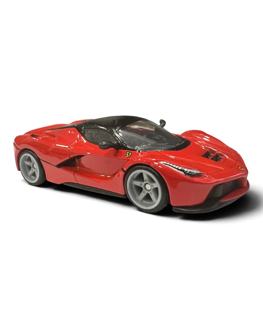 VaultifyUK Hot Wheels Premium Ferrari LaFerrari die-cast car in Rosso Corsa red with grey Real Riders wheels.