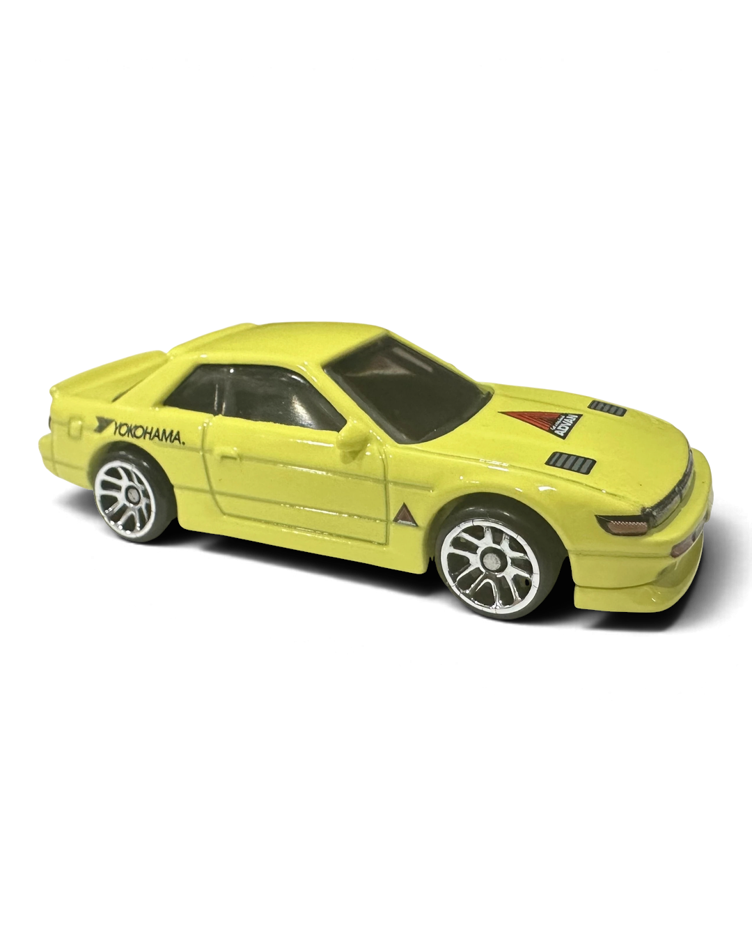 VaultifyUK Hot Wheels Nissan Silvia S13 die-cast car in pale yellow with Yokohama and Advan racing graphics