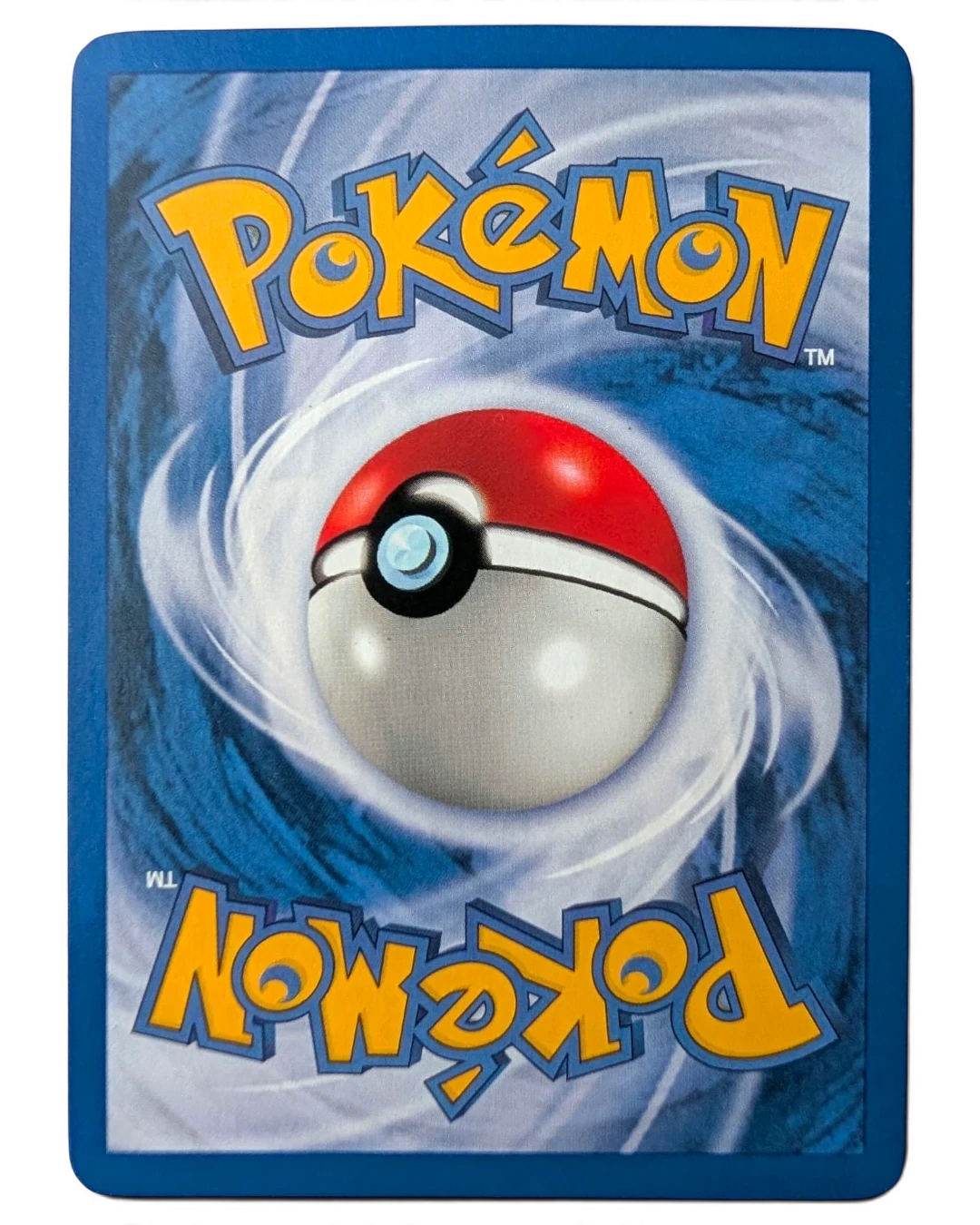 VaultifyUK vintage Pokémon TCG card back showing the classic blue swirl design and red and white Poké Ball logo