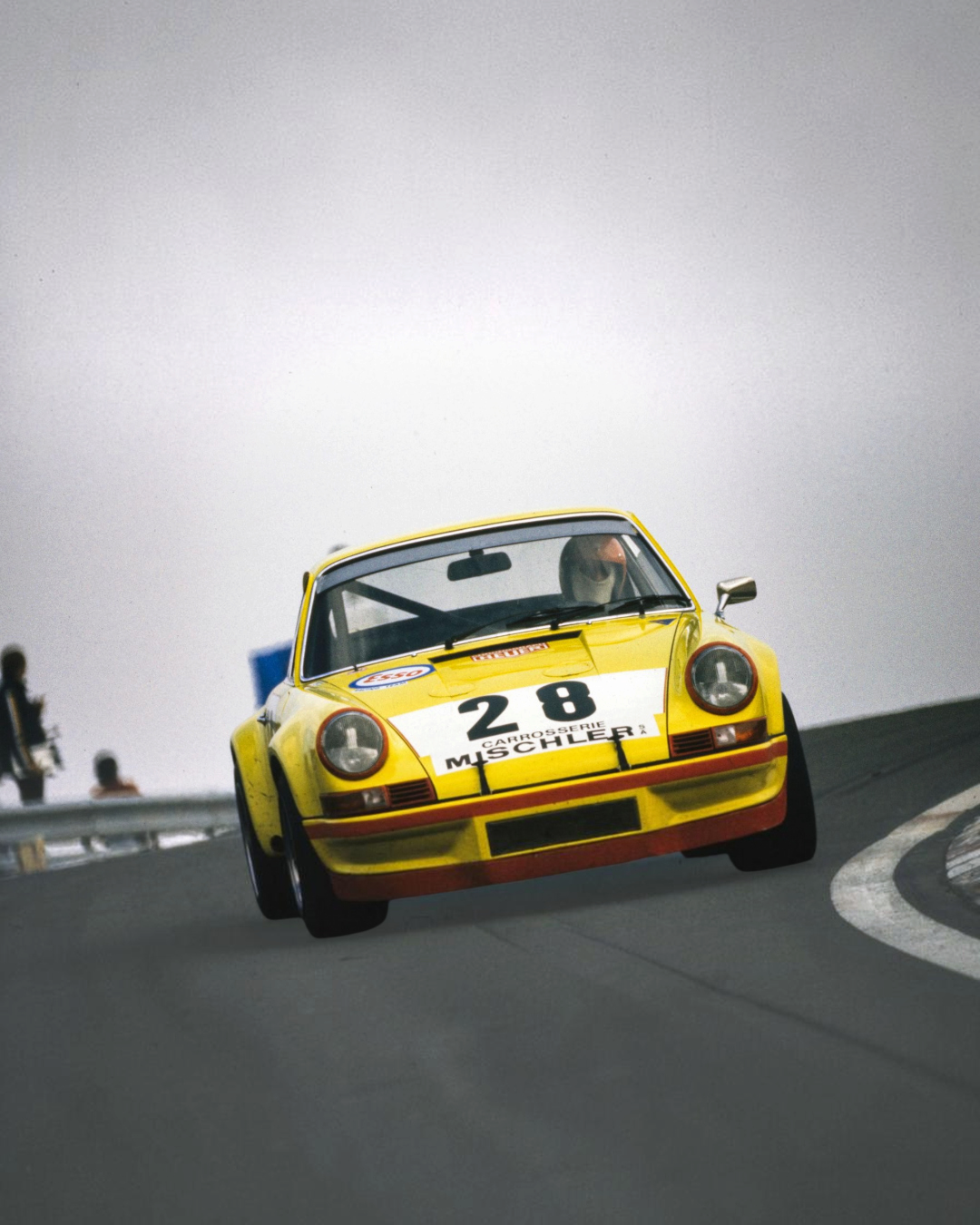 VaultifyUK 1:18 scale yellow Porsche 911 RSR race car model with number 28 livery on a track