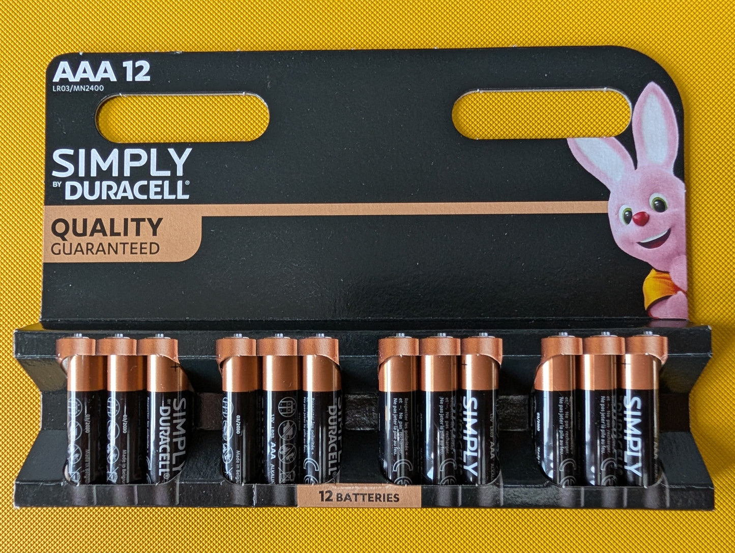 Pack of Duracell AAA batteries with a cartoon rabbit character on a yellow background