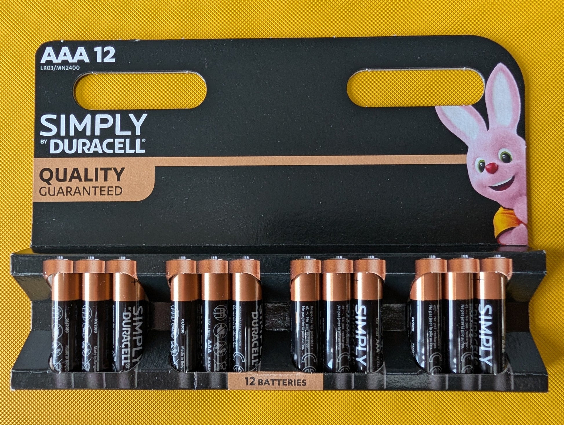 Pack of Duracell AAA batteries with a cartoon rabbit character on a yellow background