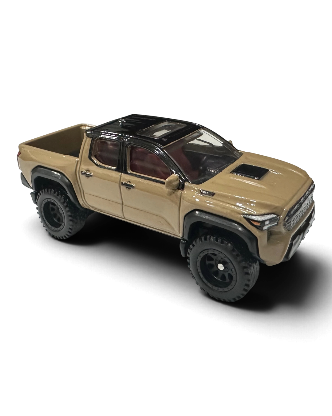 VaultifyUK Hot Wheels 2024 Toyota Tacoma TRD Pro in sandy tan with black wheels and off-road tyres, 1:64 scale model.