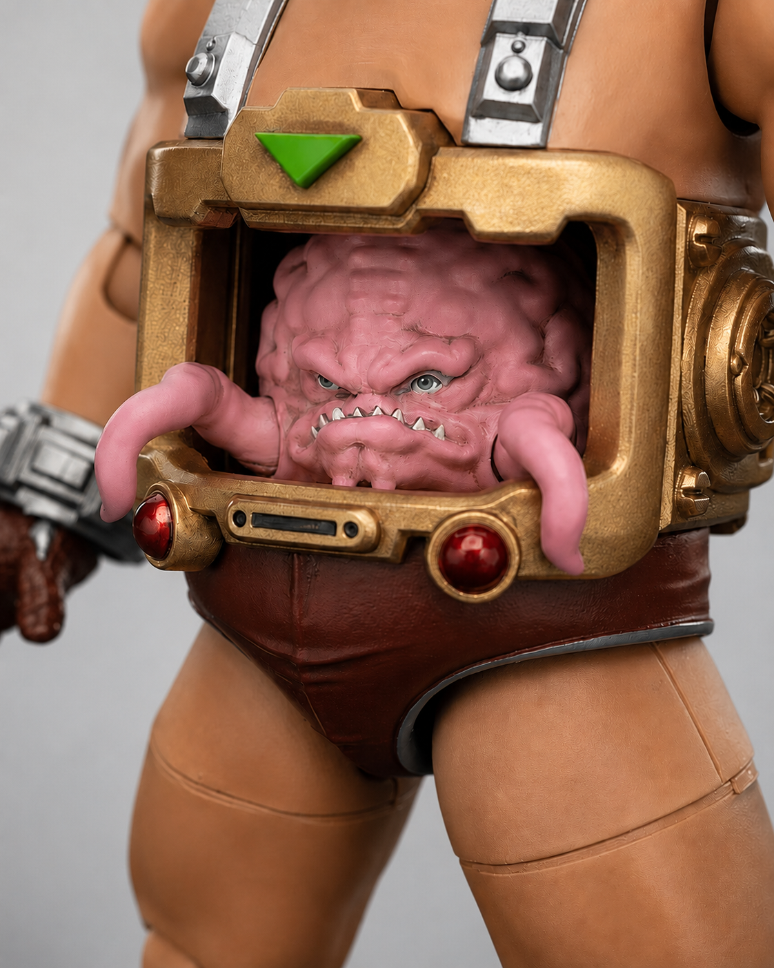 Close-up of Krang inside the gold control compartment of the JoyToy android body