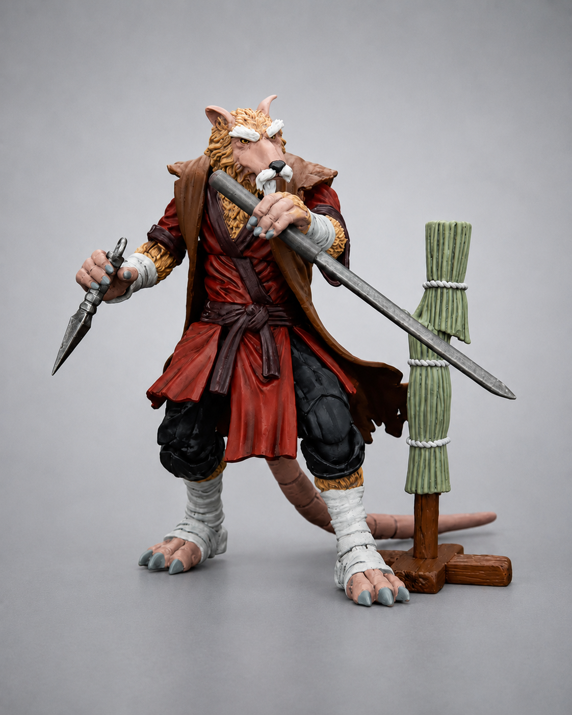JoyToy TMNT Master Splinter action figure posed with staff, dagger and martial arts training post
