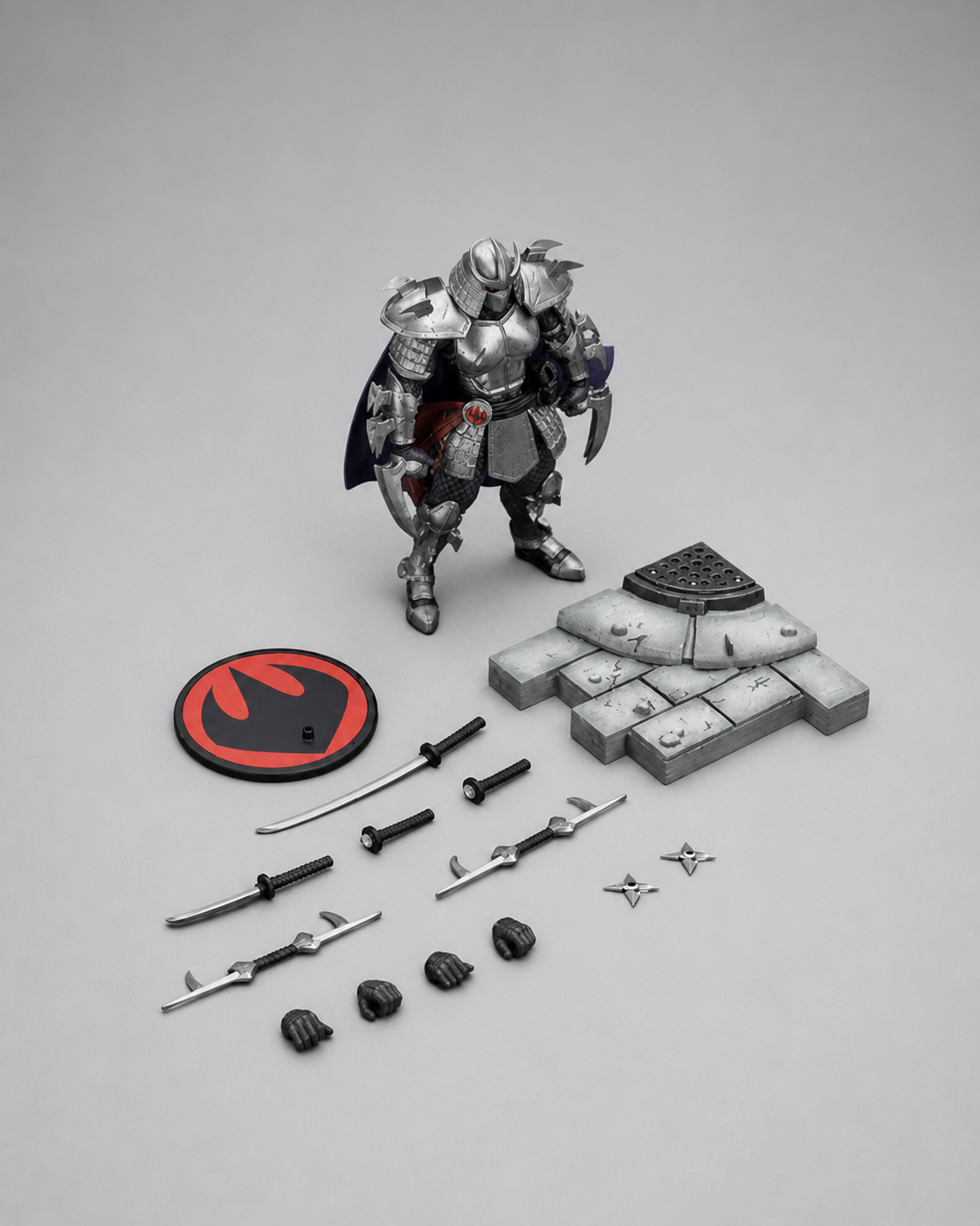 JoyToy TMNT Shredder figure with swords, polearms, throwing stars, interchangeable hands, display stand and sewer base