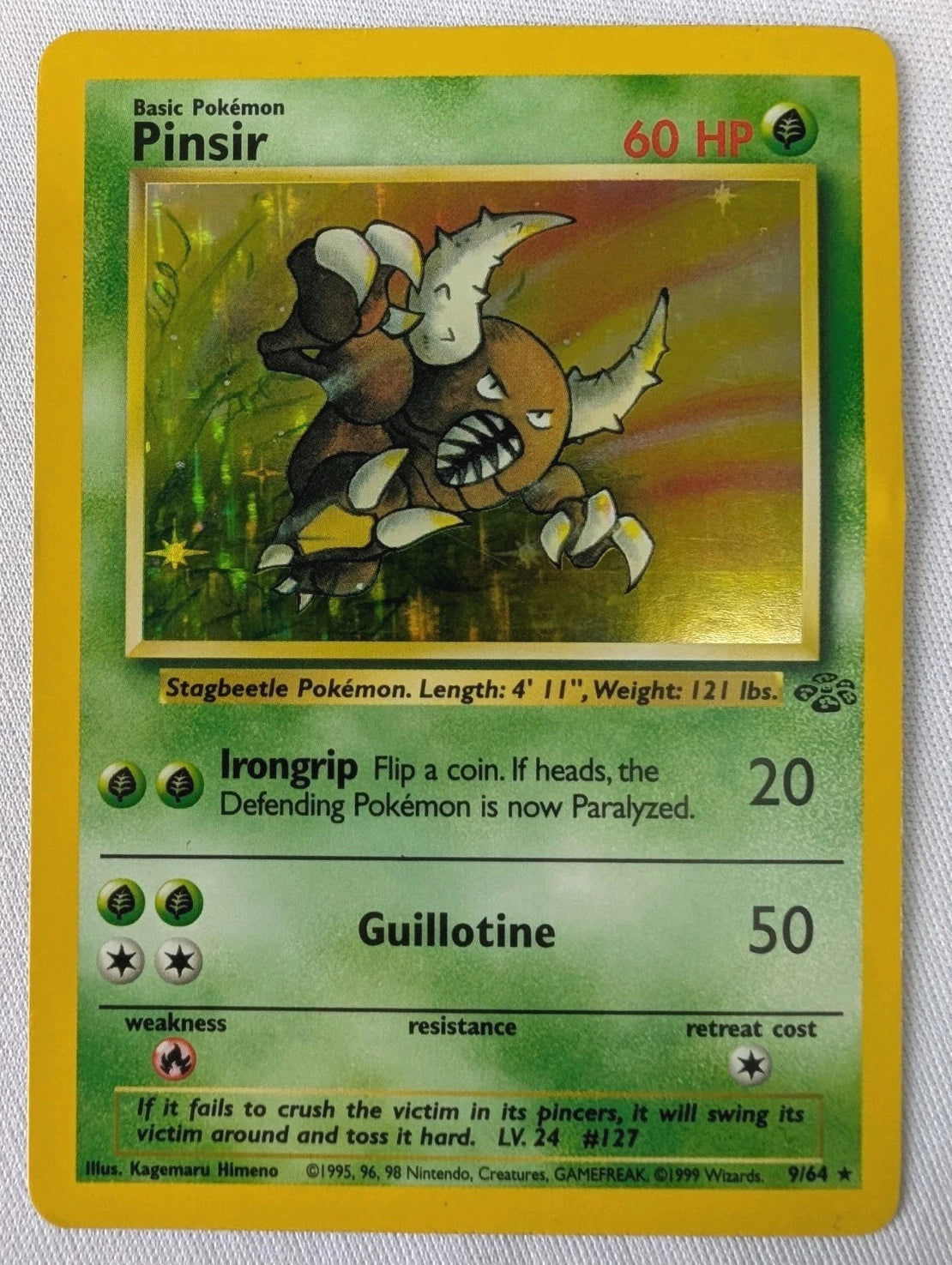 Pokémon trading card featuring Pinsir on a textured gray background
