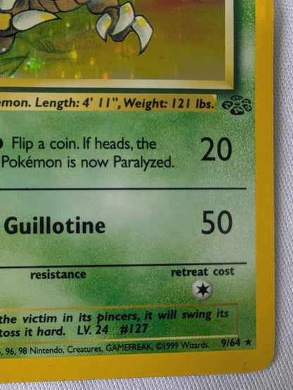 Close-up of a Pokémon trading card with text and graphics on a textured surface