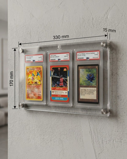 VaultifyUK 3-slab acrylic wall display frame holding three graded PSA trading cards with metal mounting standoffs.