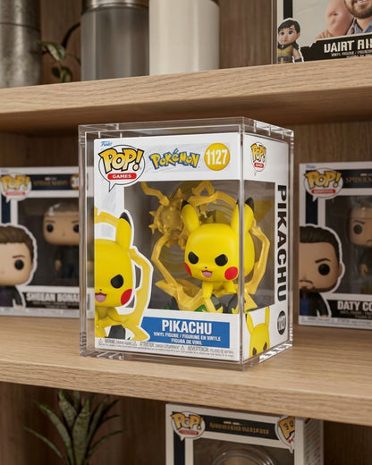 VaultifyUK crystal-clear acrylic display case protecting a Pikachu Funko Pop! Premium figure on a wooden shelf