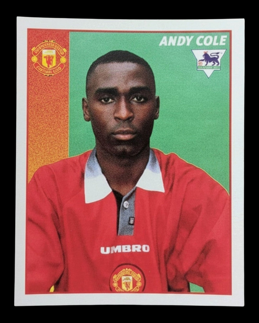 VaultifyUK 1997 Merlin Premier League sticker featuring Manchester United footballer Andy Cole in a red Umbro kit.