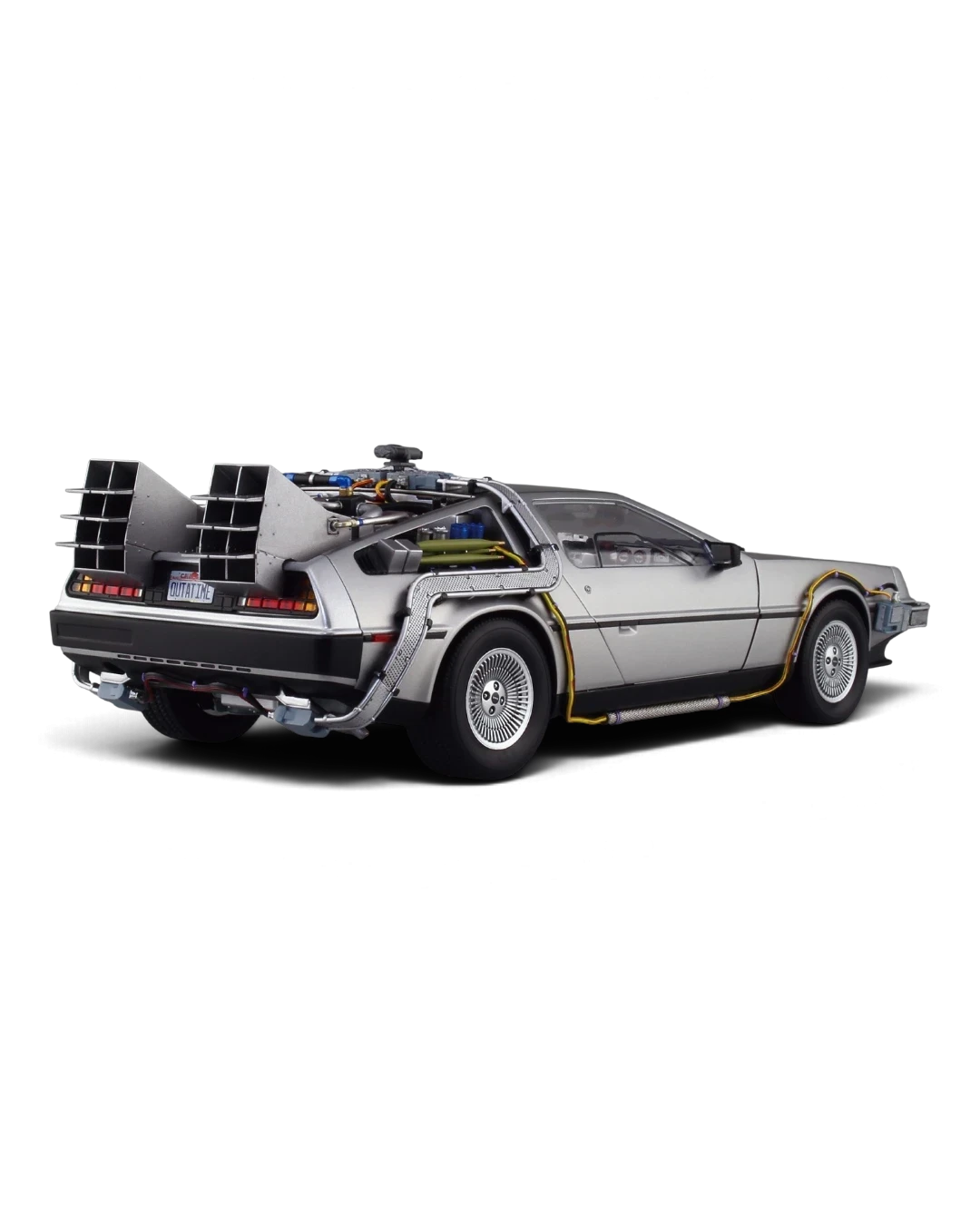 VaultifyUK 1:24 scale Aoshima Back to the Future DeLorean model kit showing rear view with gull-wing doors and details.