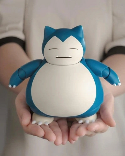 VaultifyUK Blokees Pokémon Snorlax model kit held in hands, featuring the classic blue and cream character design.