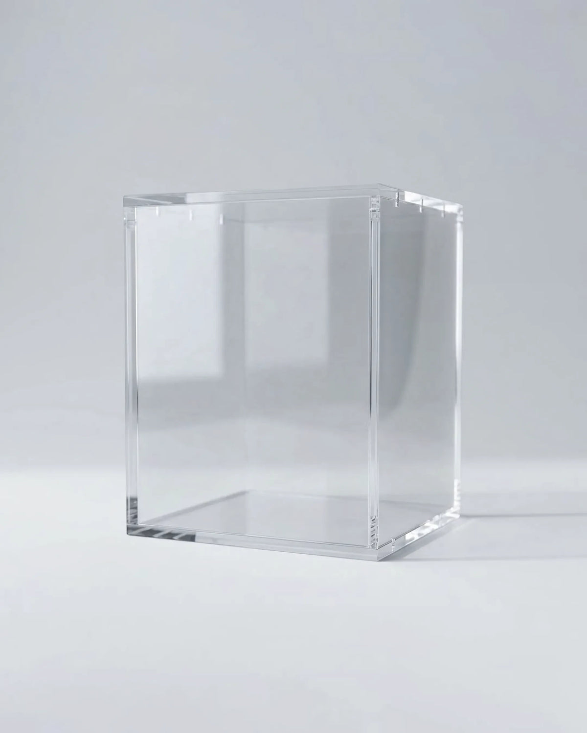 VaultifyUK clear acrylic display case for collectible figures and models with a magnetic lid on a white background