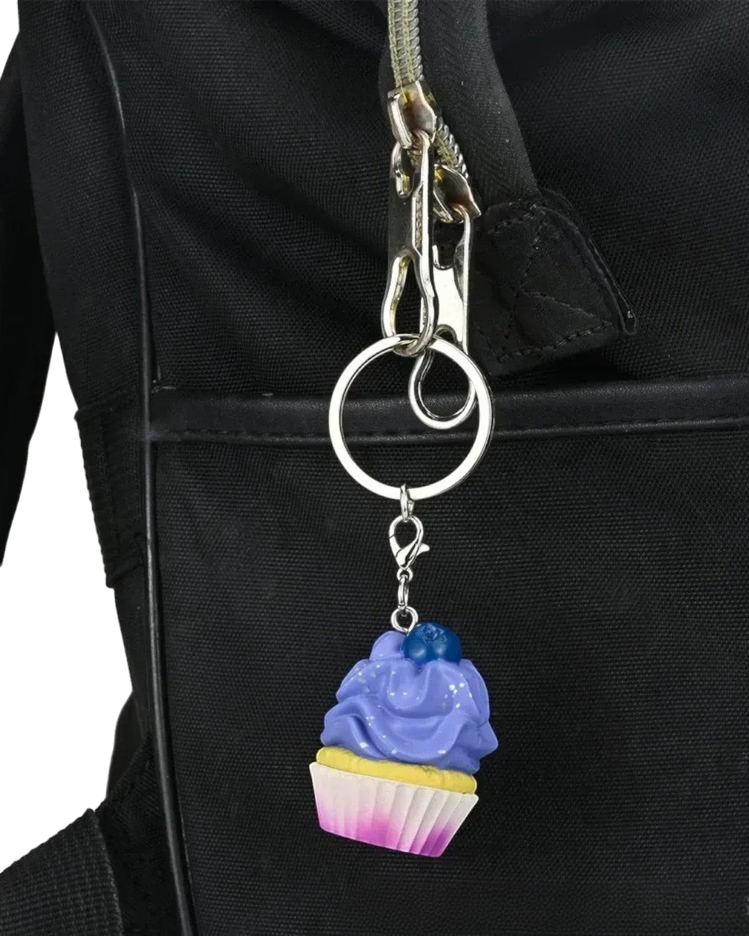 VaultifyUK Critical Role Taste of Exandria blueberry cupcake charm on a metal keyring attached to a black bag