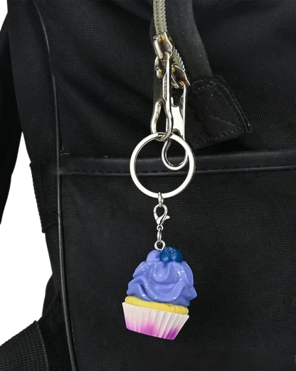 VaultifyUK Critical Role Taste of Exandria blueberry cupcake charm on a metal keyring attached to a black bag