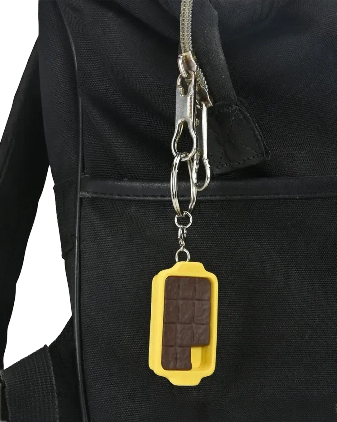 VaultifyUK Critical Role Taste of Exandria FCG baking sheet charm attached to a black backpack zipper