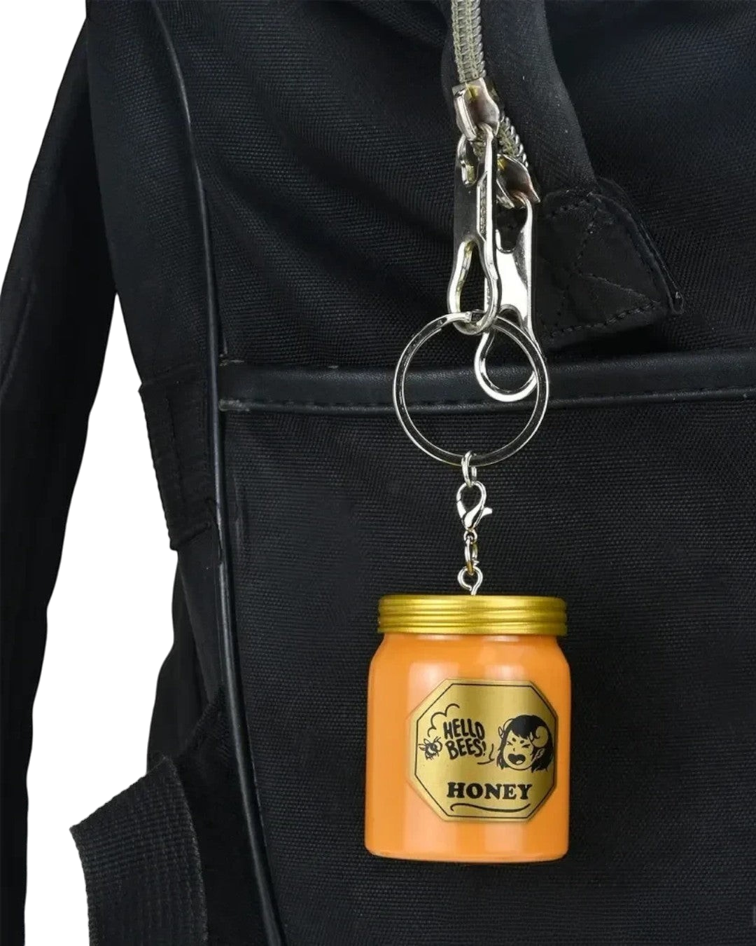 VaultifyUK Critical Role Hello Bees honey jar charm attached to a black backpack zipper
