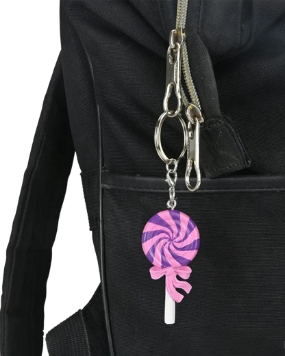VaultifyUK Critical Role Jester's Lollipop food charm attached to a black backpack zipper