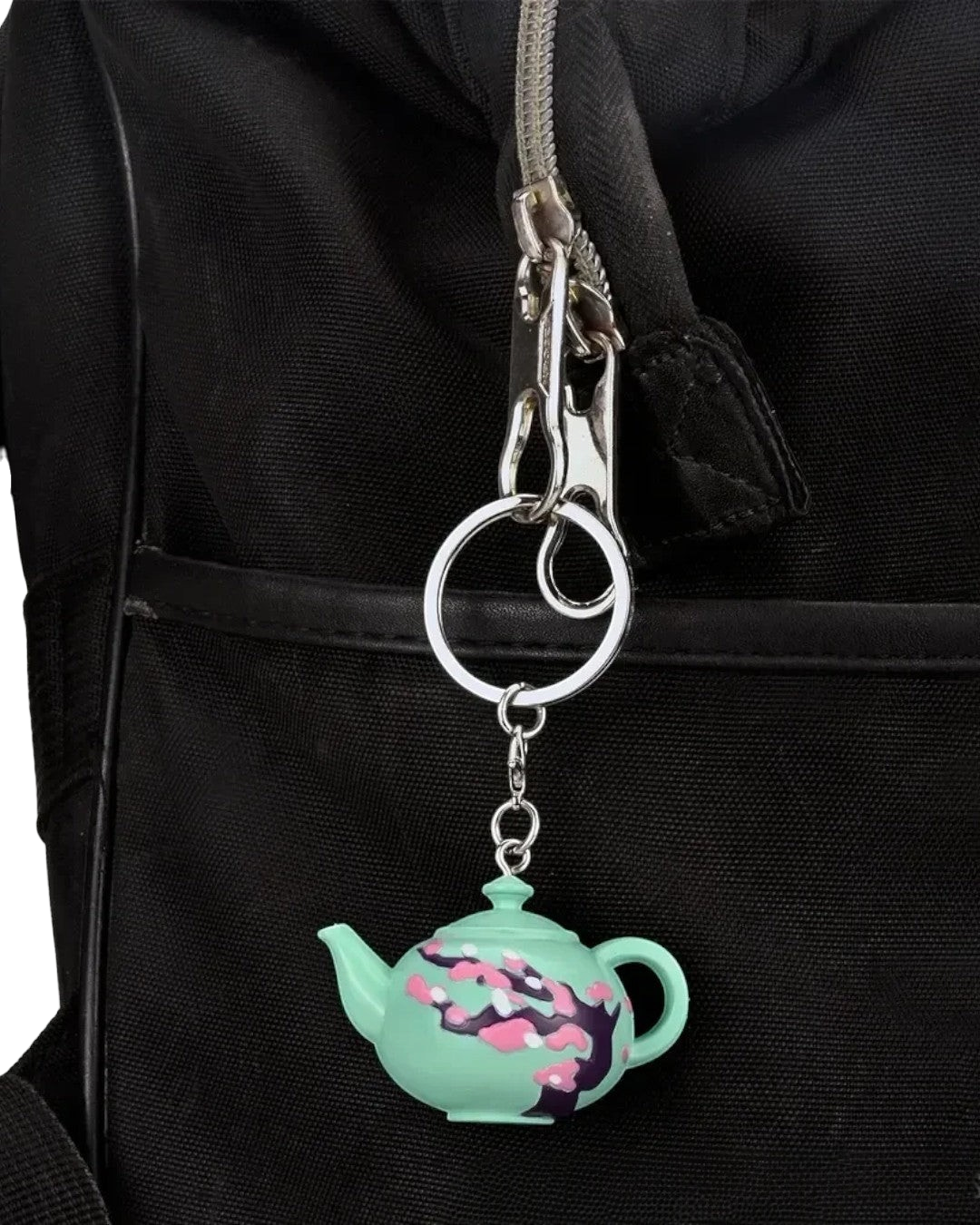 VaultifyUK Critical Role Taste of Exandria Caduceus teapot charm attached to a black bag zipper