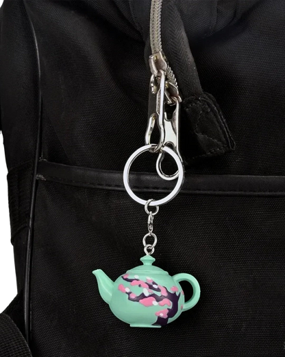VaultifyUK Critical Role Taste of Exandria Caduceus teapot charm attached to a black bag zipper