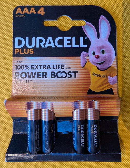 Duracell Plus AAA 4-pack alkaline batteries retail packaging, power boost actives.