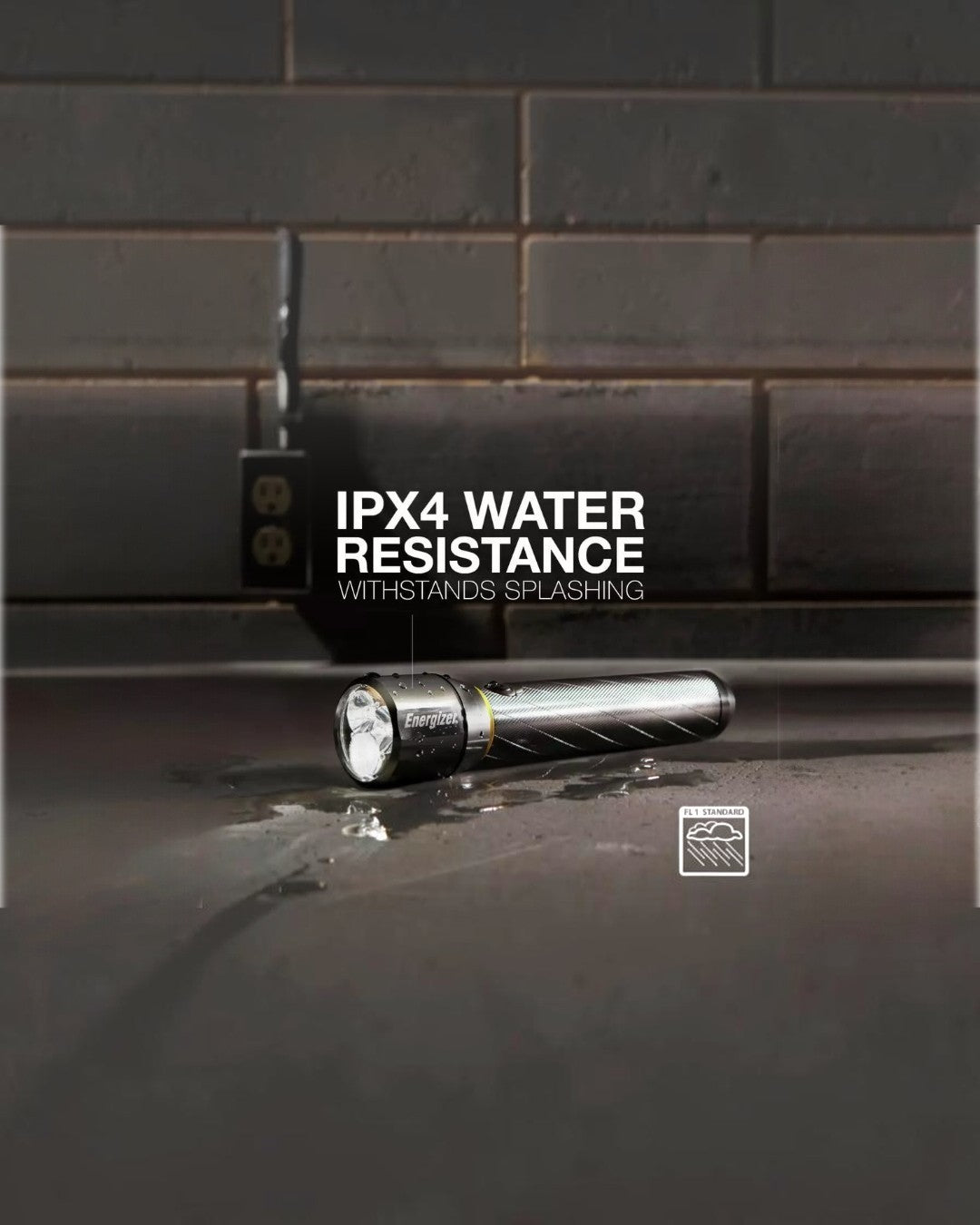 VaultifyUK Energizer Vision HD metal torch with IPX4 water resistance, shown on a wet surface with water splashes.