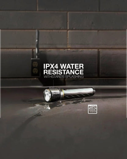VaultifyUK Energizer Vision HD metal torch with IPX4 water resistance, shown on a wet surface with water splashes.