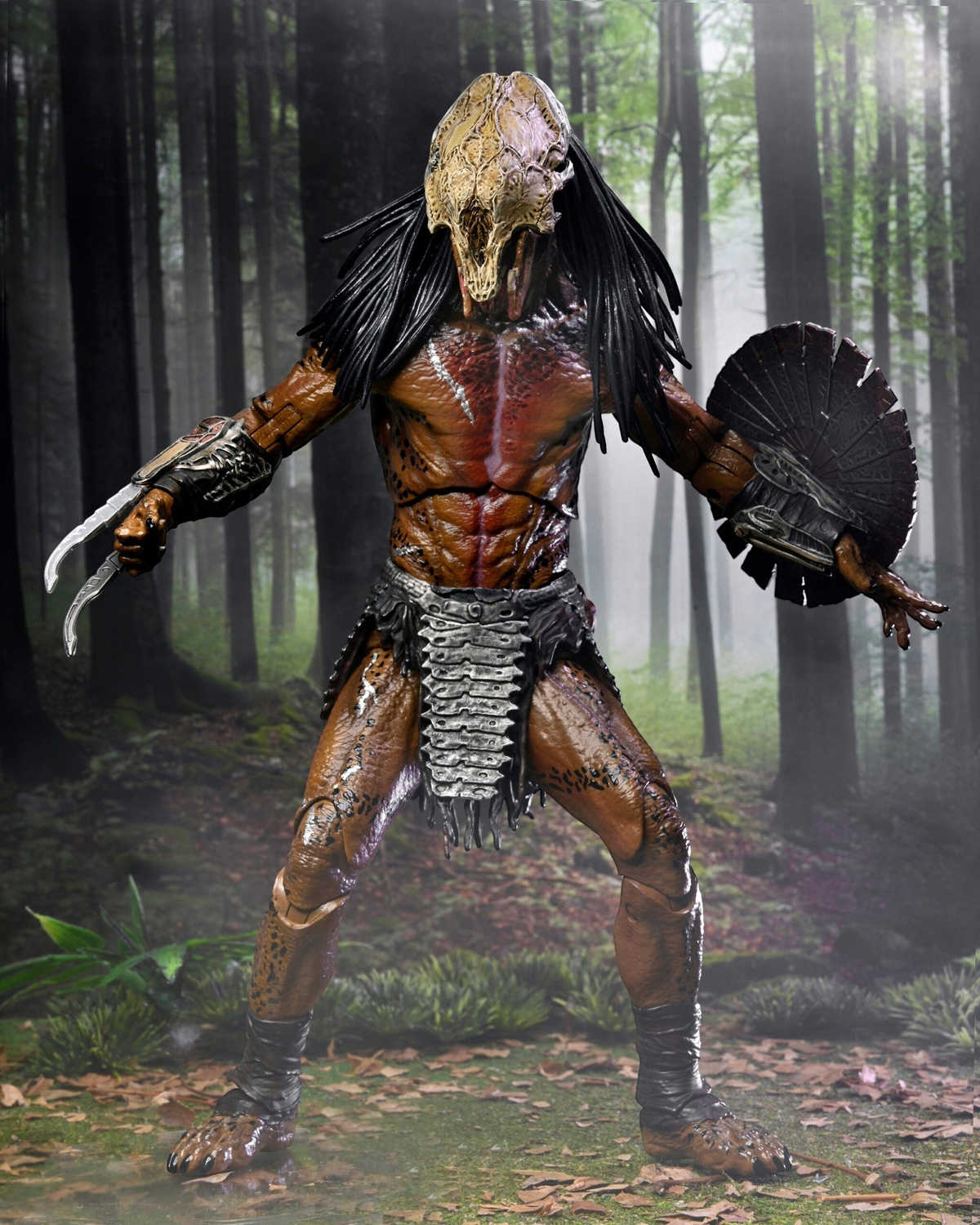 VaultifyUK NECA Prey Feral Predator 7-inch action figure with bone mask, wrist blades, and shield in a forest setting.