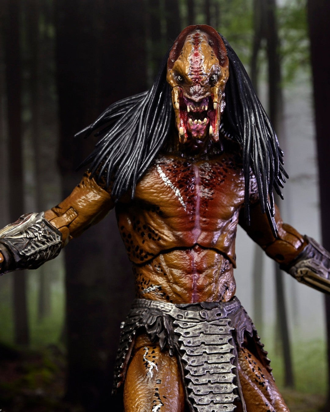 VaultifyUK NECA Prey Feral Predator 7-inch action figure with detailed textured skin, metallic armor, and long hair.