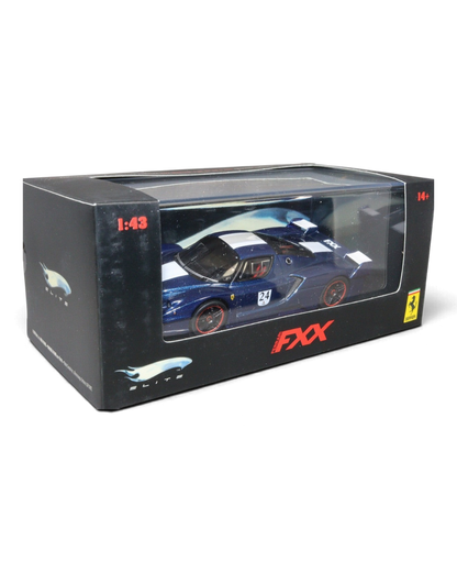 VaultifyUK Hot Wheels Elite 1:43 scale Ferrari FXX #24 diecast model car in blue and white livery inside display box.
