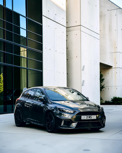 The real Ford Focus Mk3 RS: a dark Focus RS outside white Georgian townhouses (not the exact car Corgi modelled)
