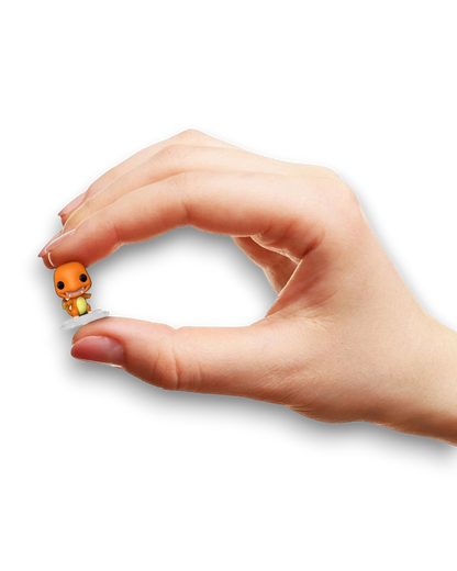 VaultifyUK Funko Bitty Pop! miniature Charmander figure held between fingers to show its tiny scale
