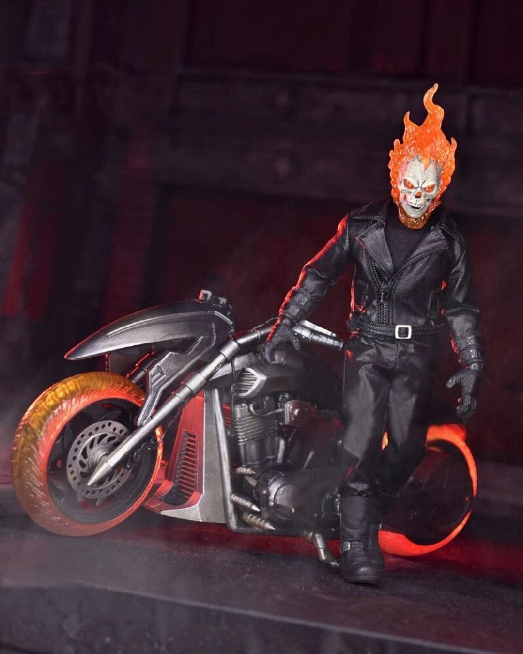 VaultifyUK Mezco One:12 Collective Ghost Rider action figure with light-up flaming skull standing by his Hell Cycle