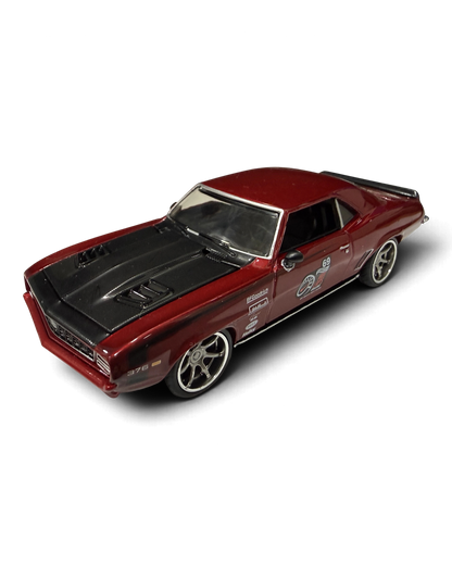 VaultifyUK Hot Wheels 1969 Camaro Pro Touring die-cast car in metallic red with matte black hood and silver wheels.