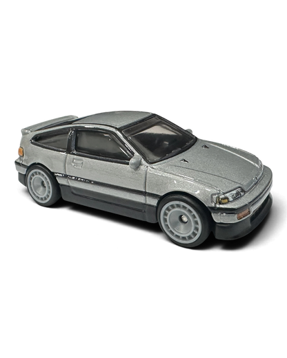VaultifyUK Hot Wheels 1:64 scale silver 1988 Honda CR-X diecast car with aero disc wheels and metal body.