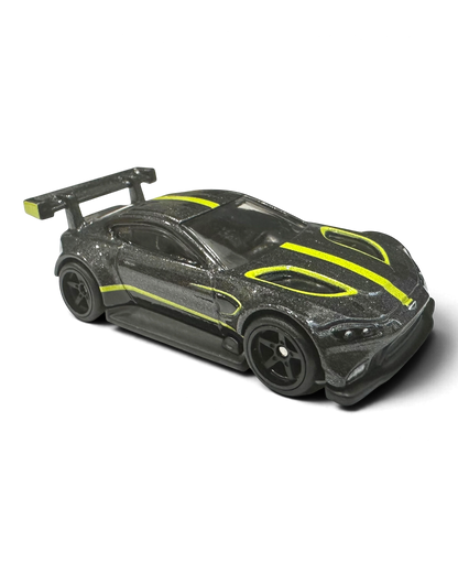 VaultifyUK Hot Wheels Aston Martin Vantage GTE die-cast car in dark grey with lime-green racing stripes and rear wing.