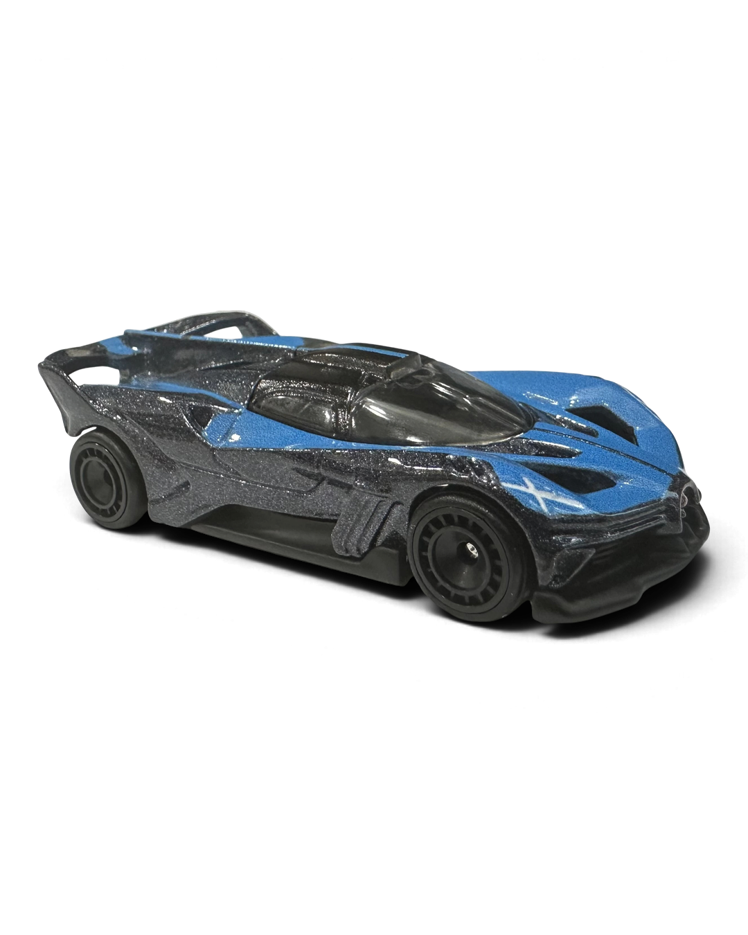 VaultifyUK Hot Wheels Premium Bugatti Bolide die-cast car in metallic blue and black with Real Riders wheels.