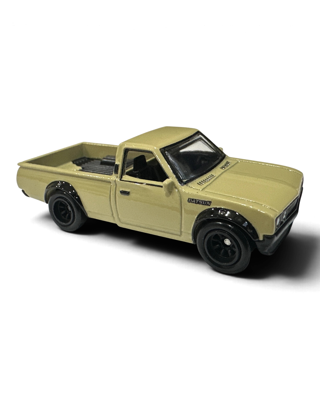 VaultifyUK Hot Wheels Datsun 620 die-cast truck in cream with black over-fenders and Real Riders wheels.
