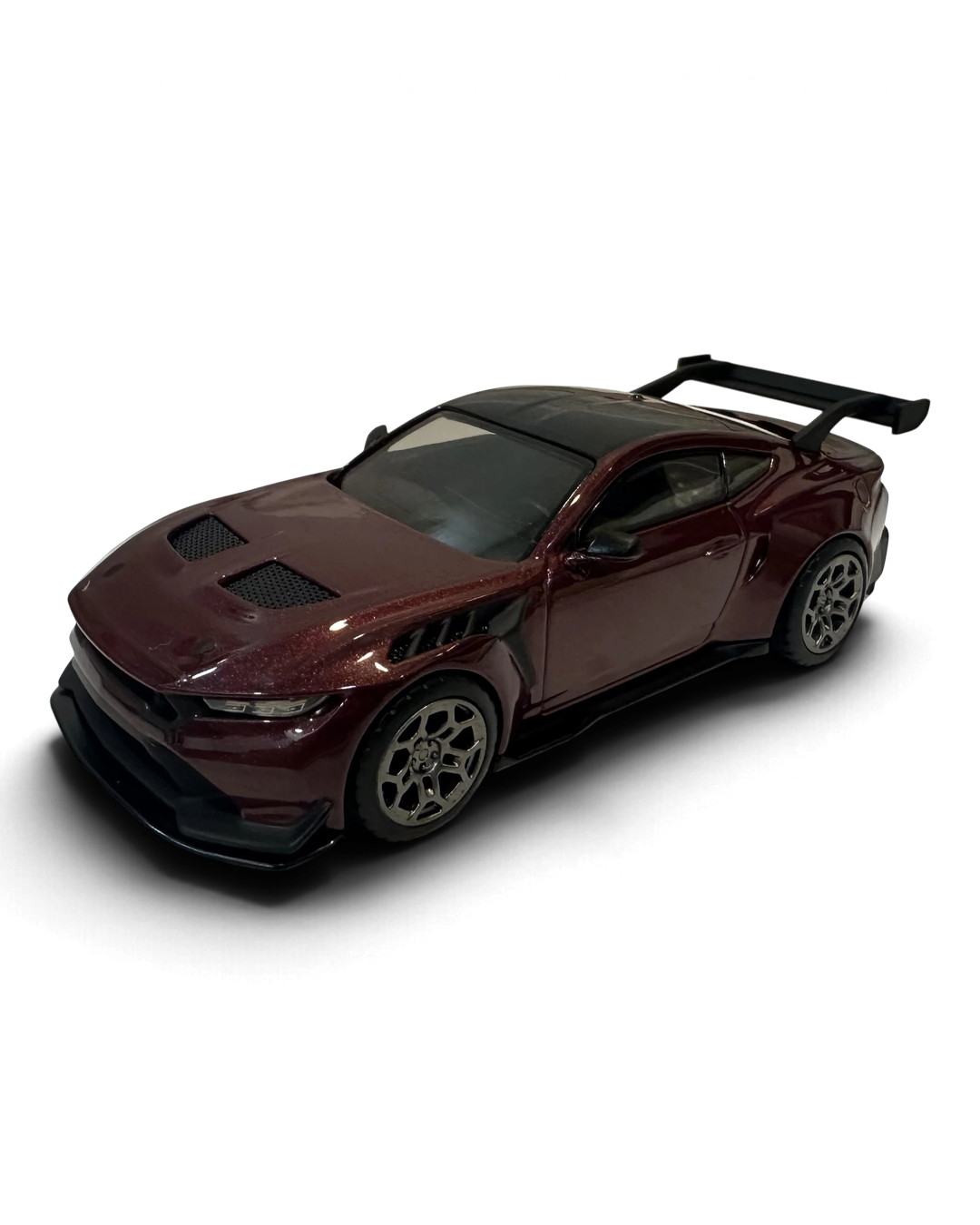VaultifyUK Hot Wheels Premium 1:43 scale deep red Ford Mustang GTD diecast car with black carbon-look accents.