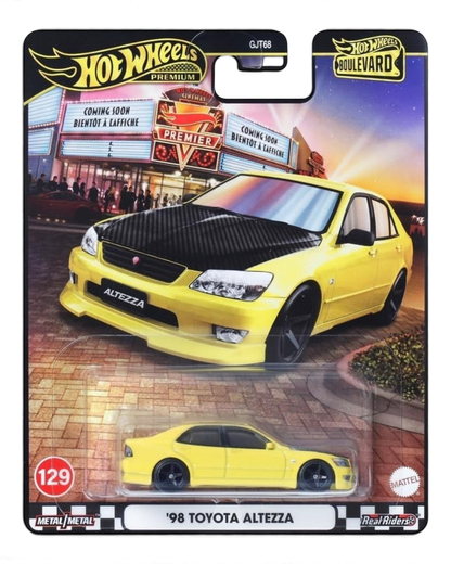 VaultifyUK Hot Wheels Premium 98 Toyota Altezza die-cast car in yellow with a black carbon-effect bonnet on card.