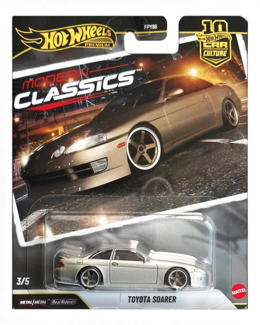 VaultifyUK Hot Wheels Premium Toyota Soarer in metallic gold with silver five-spoke wheels in blister packaging.