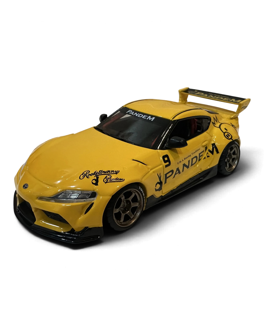 VaultifyUK Hot Wheels Premium 1:43 yellow Toyota Supra GR Pandem widebody die-cast car with bronze wheels and rear wing