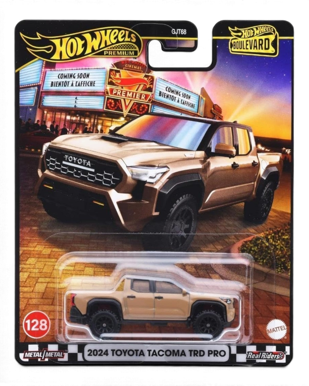 VaultifyUK Hot Wheels Premium 2024 Toyota Tacoma TRD Pro in sandy tan with black off-road wheels in blister packaging.