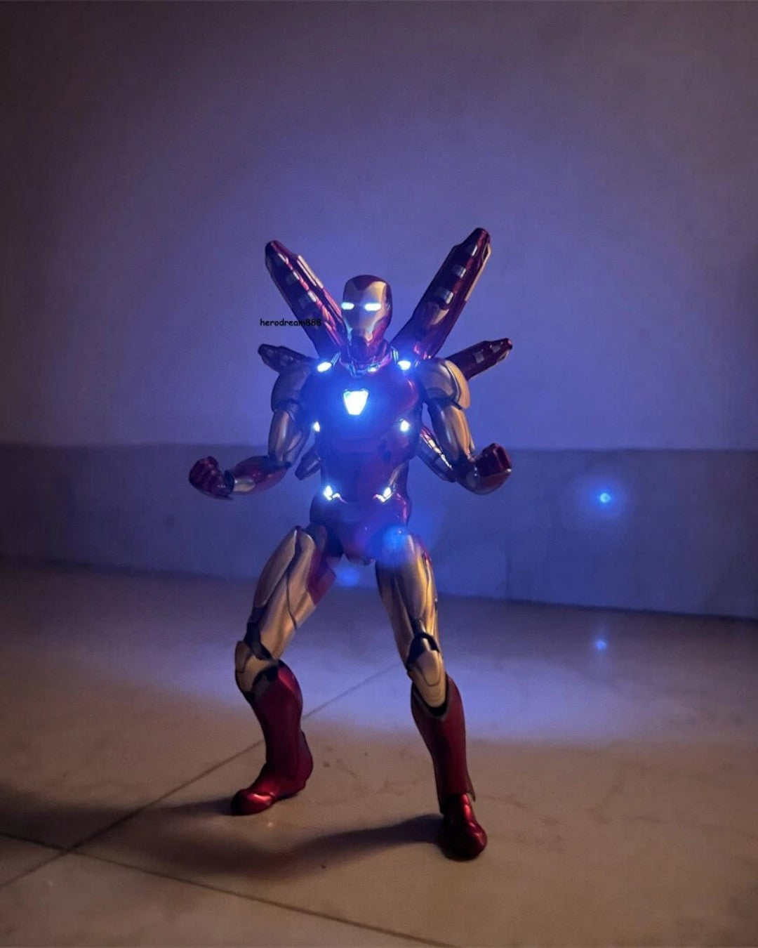 VaultifyUK Iron Man MK85 2.0 LED figure in metallic red and gold armour with glowing arc reactor and back thrusters