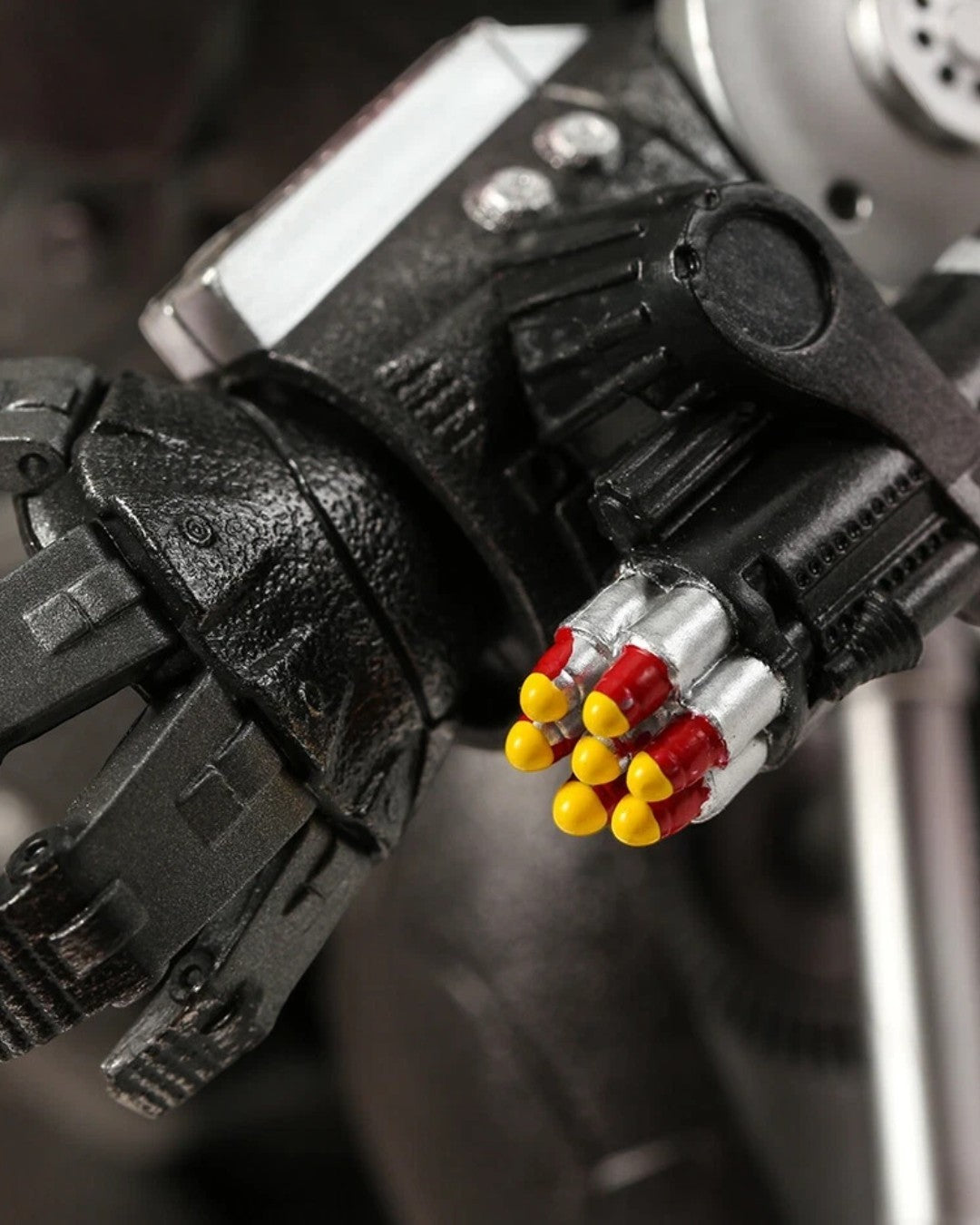 VaultifyUK ZD Toys Iron Monger 1/10 scale figure showing detailed mechanical arm with red and yellow missile launcher
