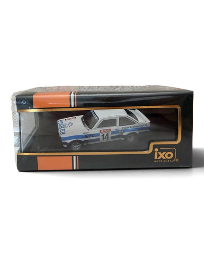 VaultifyUK IXO 1:43 scale Ford Escort Mk2 RS1800 rally car model in white with blue stripes in its display box.