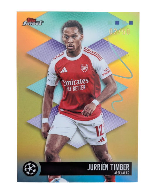 VaultifyUK Jurriën Timber 2025-26 Topps Finest gold parallel football card featuring Arsenal player in home kit
