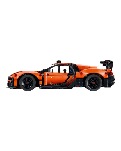 VaultifyUK LEGO Technic Bugatti Chiron Pur Sport hypercar model in orange and black, side profile view.